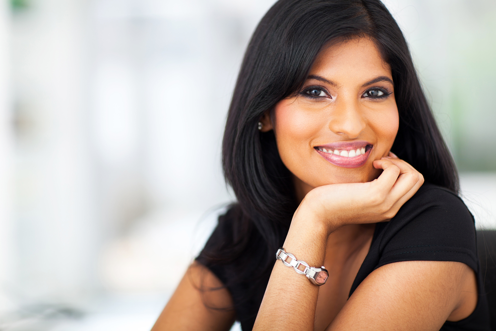 indian woman with white dental crowns