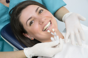 woman at dentist deciding on dental implants woman at dentist deciding on dental implants